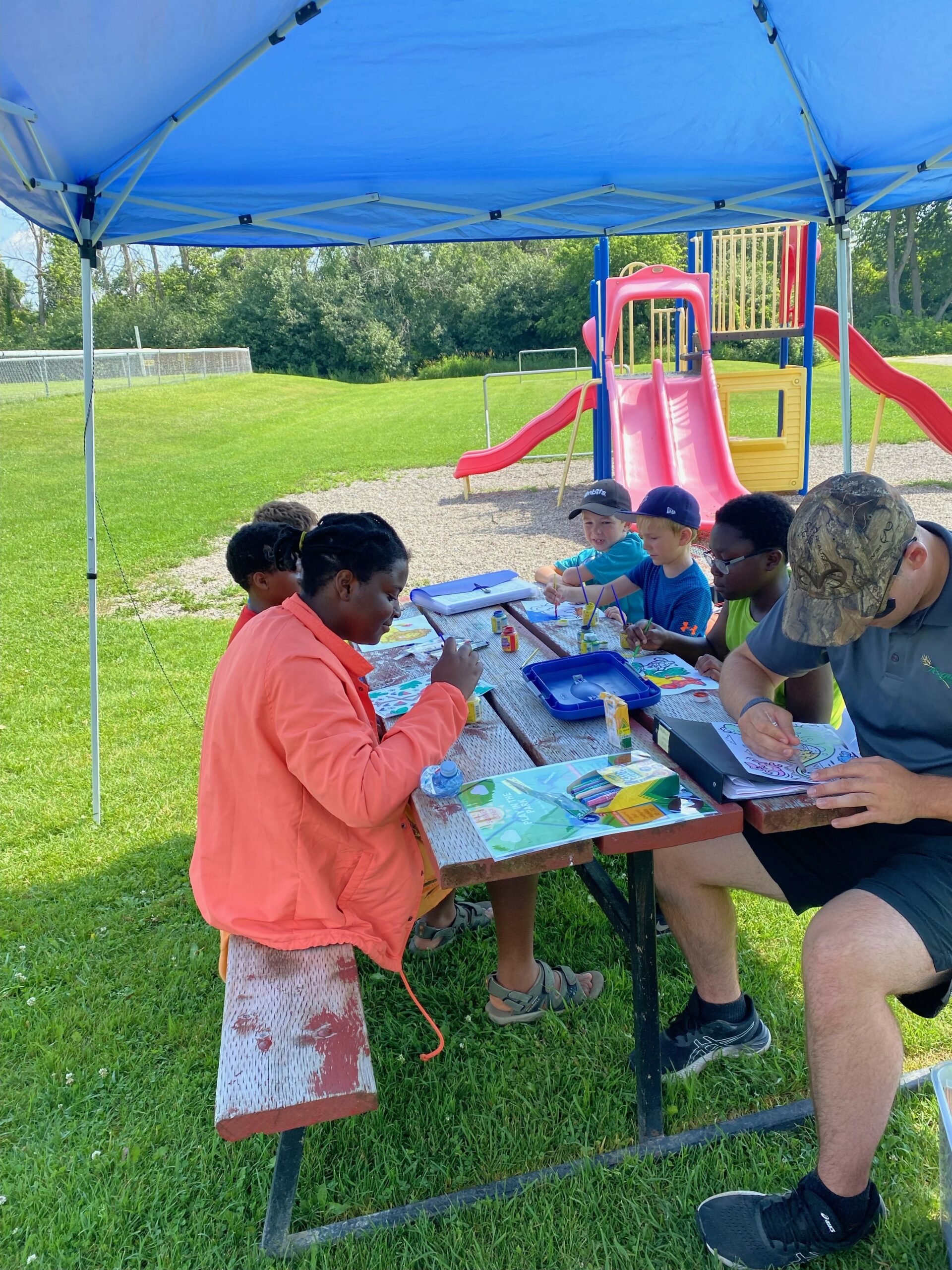 kids colouring during Play in the Park