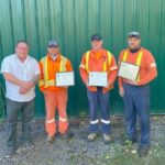 Brad Thake presenting service recognition awards to Tyler Cuffe, Tom Shorey and Mark Dawson
