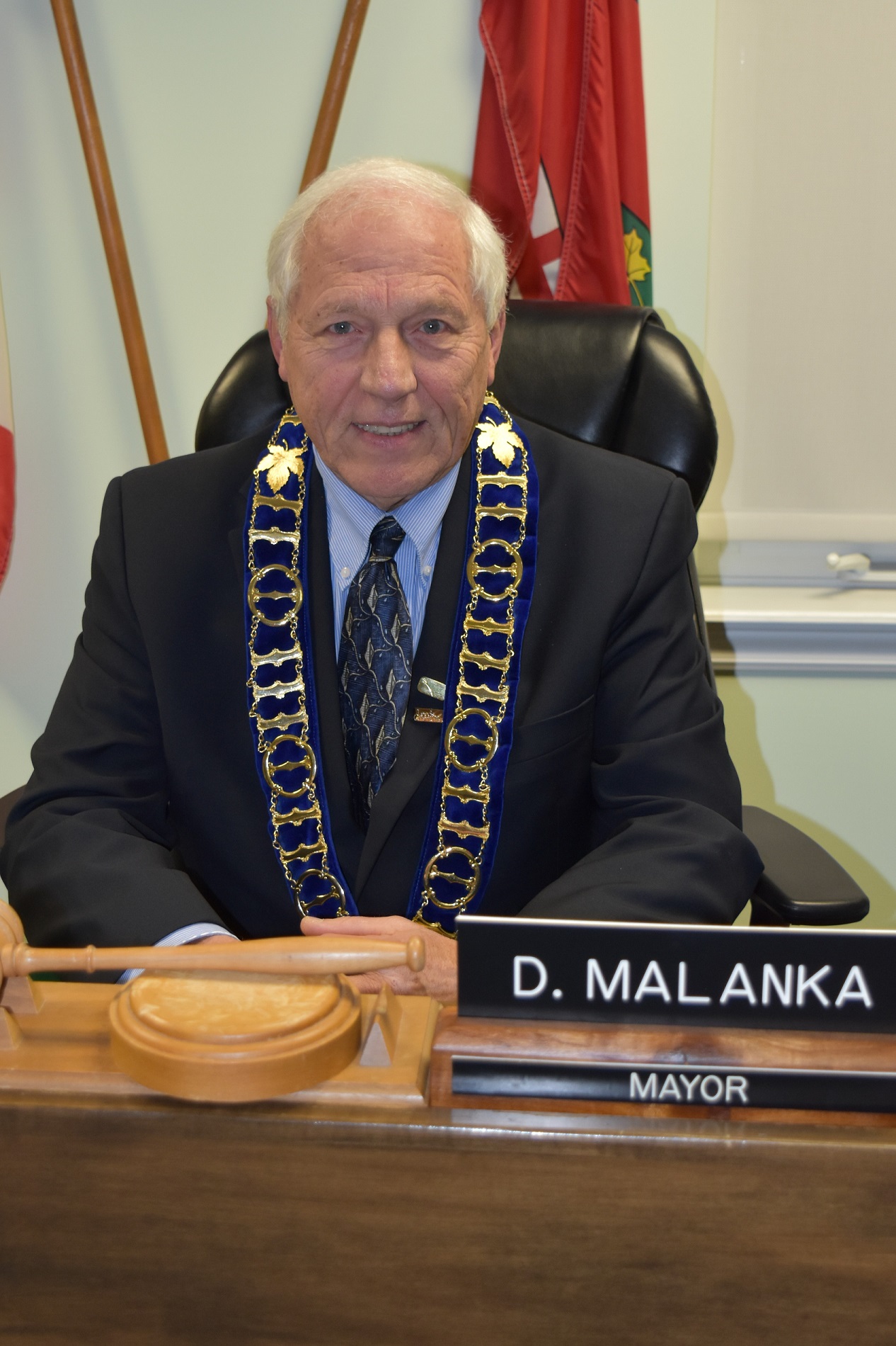 doug malanka in his seat in the council chambers