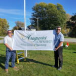 Public Works Manager Brad Thake and CAO Bryan Brown holding the new Augusta Township flag