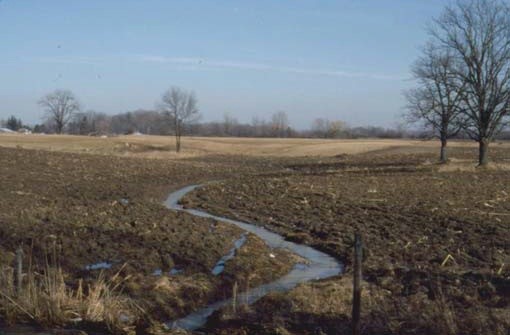 Figure 3. A private ditch or channel across a low area is not usually considered to be a natural watercourse.