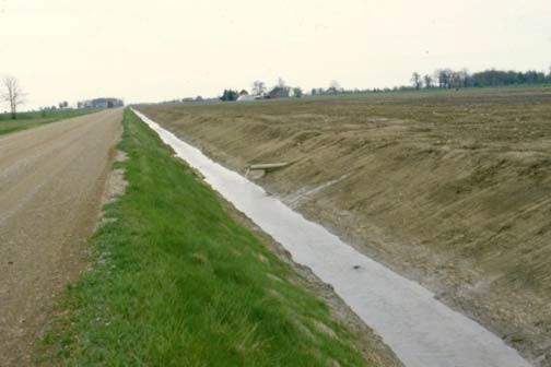 Figure 6. Municipalities are not obliged to dig their road ditches deep enough to outlet tile drains, although these ditches often provide excellent outlets. Permission from the municipality is required.