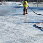 Firefighter flooding a rink